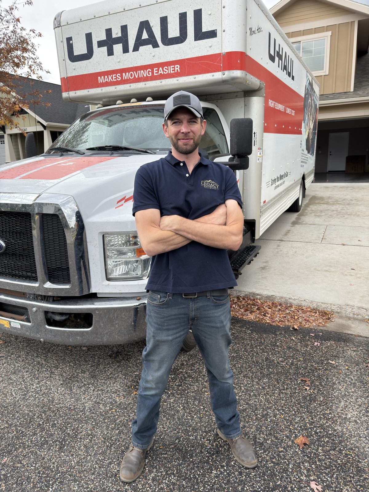 Owner of Legacy Moving Co. standing in front of a moving truck in Bozeman, Montana